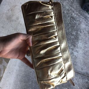 Gold clutch with tags